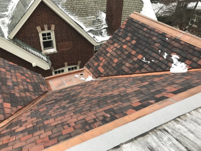 Roofer installs Copper Pan, Valleys and Ridge
