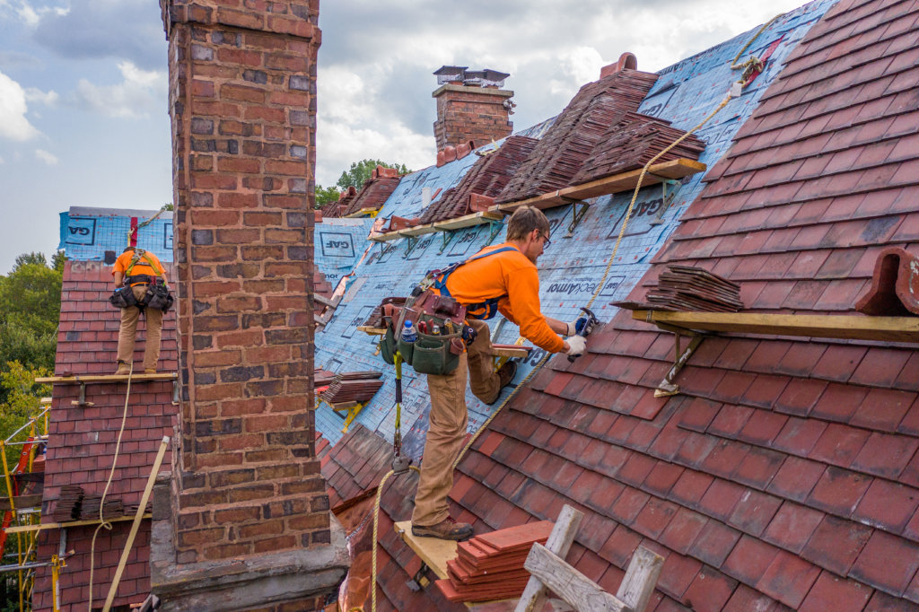 Roofers with fall protection